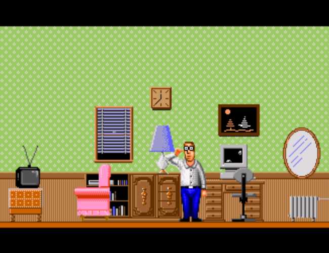 A nerdy-looking white guy in a white, button-up, collared shirt, blue pants, black shoes and square-rimmed glasses. He is standing in his living room which contains a pink chair set up in front of a small tv on a table, a small shelving unit full of books with a cabinet on the side and a lamp placed on top, a window with blinds, a square clock hanging on the wall, a picture on the wall that might be two sailboats in the night, a round mirror, a radiator, and a computer desk with an old Macintosh on top with a flying toaster screen saver running. The wall has wood paneling up to about waist height with a green wall paper patern going the rest of the way up.